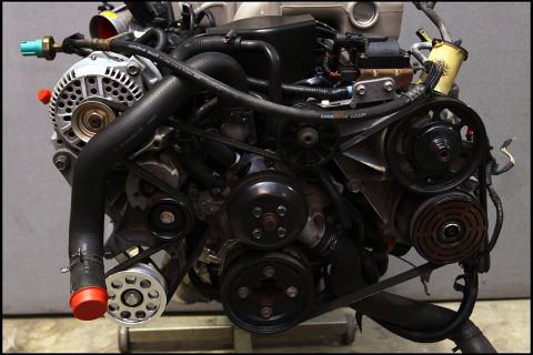 1994 Ford Bronco - Close-up view of an engine assembly, showing various components and their arrangement.