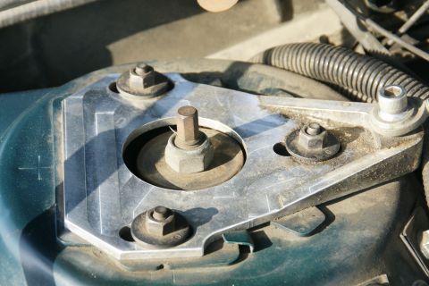1992 Ford Taurus - A close-up view of a vehicle's strut mount, showing various bolts and hardware.