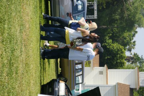 1992 Ford Taurus - Attendees observe vehicles at a car show event.
