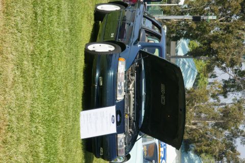 1992 Ford Taurus - This 1992 Ford Taurus SHO is displayed with its hood open, revealing the engine compartment.