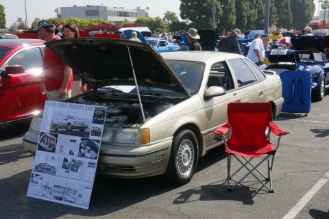 1992 Ford Taurus - A display board detailing a 1990 Ford Taurus SHO is shown at a car event.