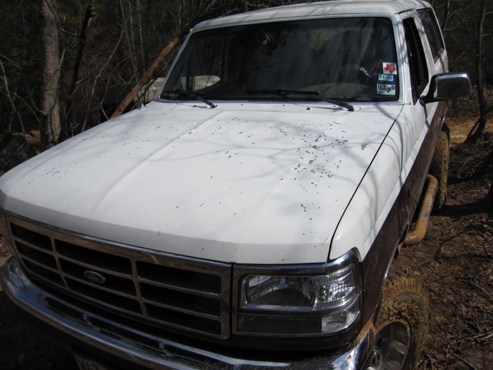 1993 Ford Bronco, white and brown, 3q-front view. Windshield sticker visible