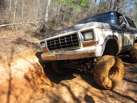 1993 Ford Bronco - This lifted Ford Bronco navigates a challenging off-road course with large tires.