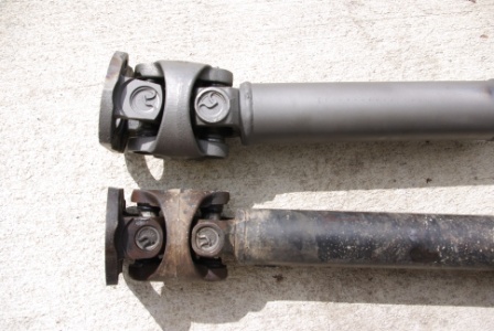 1995 Ford Bronco - Comparison of a new drive shaft next to an older, worn one.