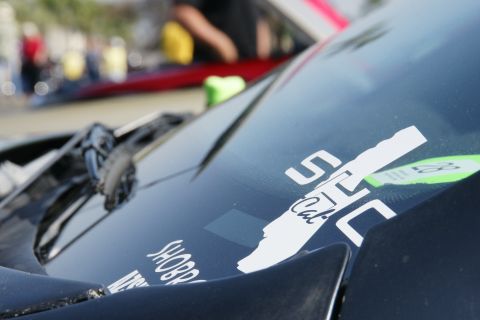 1992 Ford Taurus - A close-up of a car's windshield shows various stickers, including one with "STC Cal" and a green sticker with the number 58.