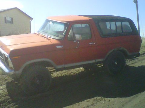 1978 Ford Bronco - This 1978 Ford Bronco is shown in a three-quarter front view, parked outdoors on a dirt lot.