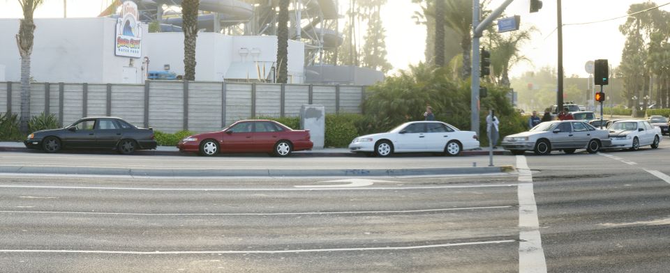 Side view of a 1992 Ford Taurus in a line of sedans