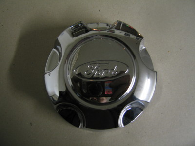 1976 Ford Torino - Chrome Ford hubcap with Ford logo is shown against a neutral background.