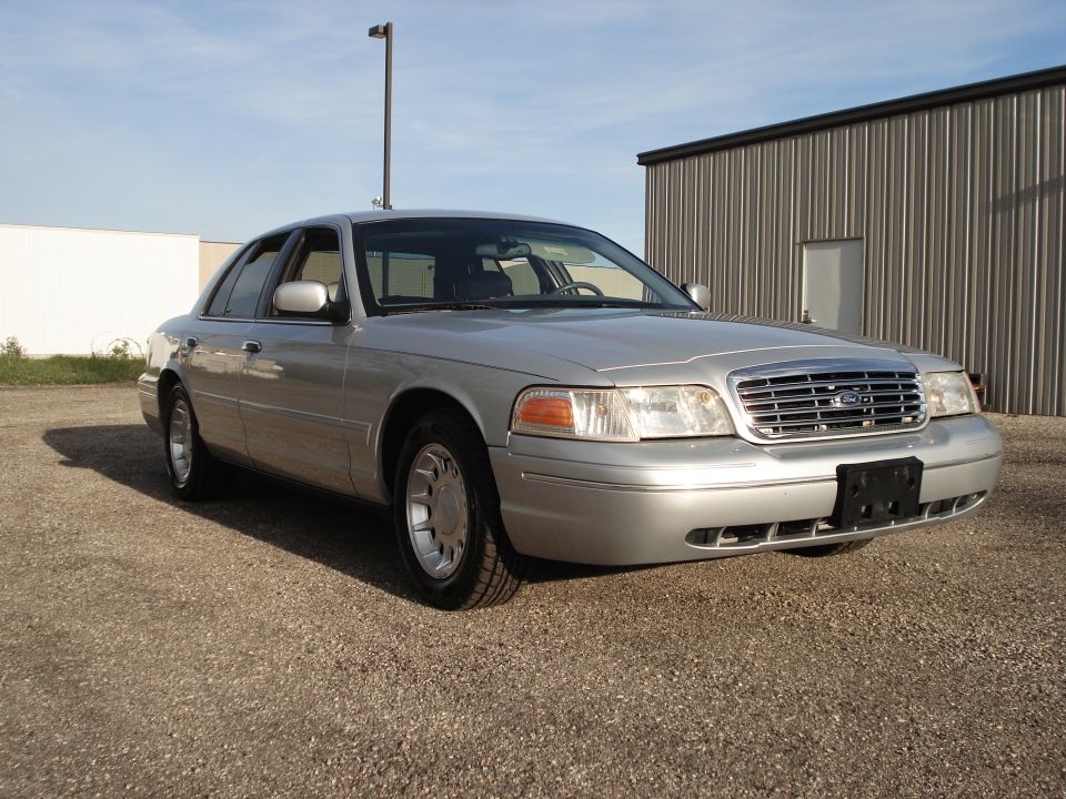 Silver 2000 Ford Crown Victoria 3/4 front view