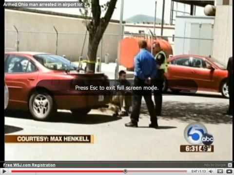 1991 Ford LTD Crown Victoria - Police interaction occurs near two red sedans in an outdoor lot.