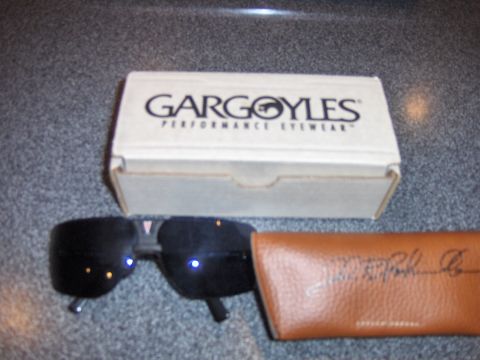 1977 Pontiac Trans Am - A pair of Gargoyles sunglasses rests next to its branded box and a leather carrying case.