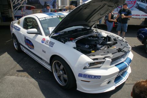 1992 Ford Taurus - White Shelby GT500 Pace Car with blue stripes and hood open, displaying the engine. Features Las Vegas Motor Speedway decals.