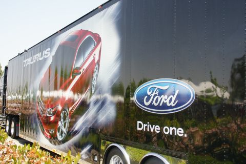 1992 Ford Taurus - A trailer features a graphic of a red Ford Taurus, along with the Ford logo and slogan.