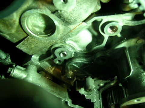 1995 Ford Probe - A detailed view of an engine's internal components, showing wear and grime.