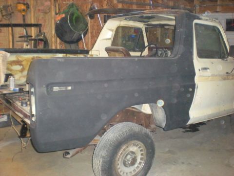 1978 Ford Bronco - This 1978 Ford Bronco is in a garage, possibly undergoing repairs or modifications.