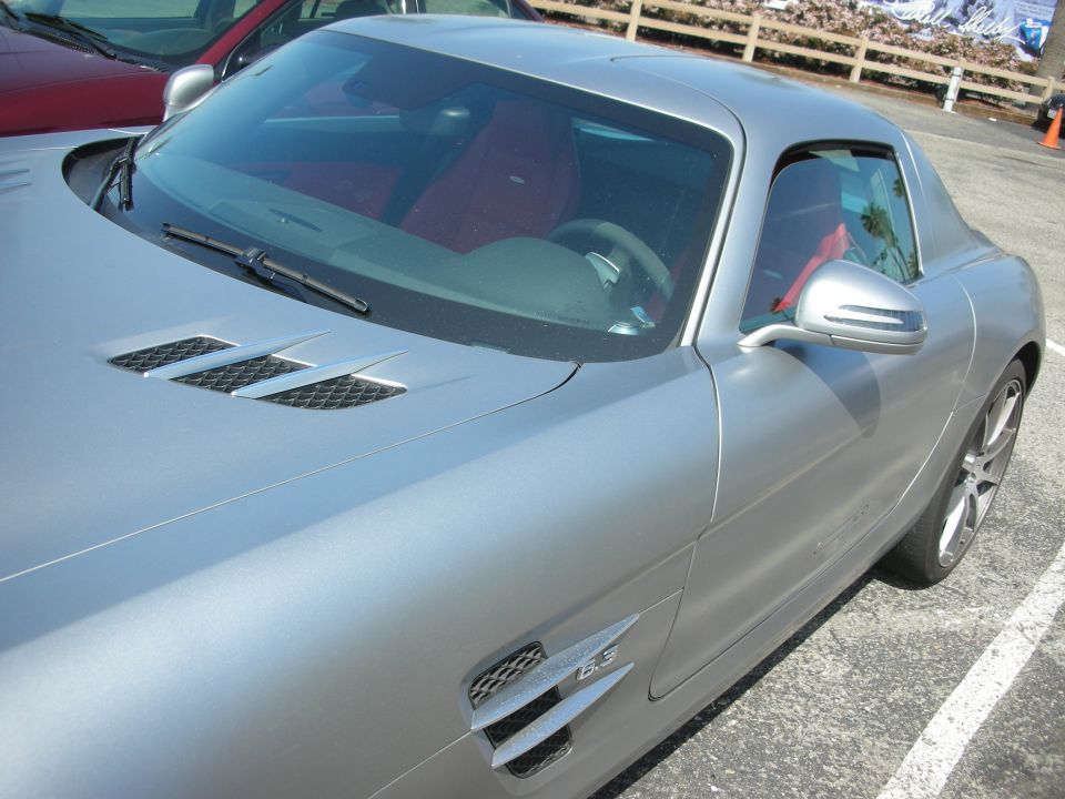 Silver coupe with red interior, side vent reads '6.3'