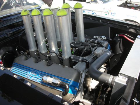 2004 Ford Crown Victoria - Custom Ford 427 SOHEC engine features six velocity stacks, each capped with a tennis ball, for a unique visual modification.
