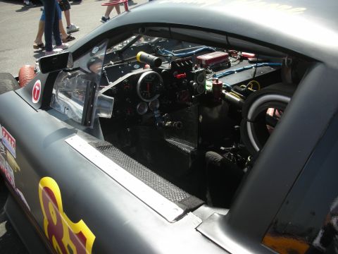 2004 Ford Crown Victoria - Interior view of a custom race car, a complex dashboard and exposed wiring.