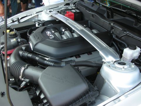 2004 Ford Crown Victoria - Close-up of a 5.0L V8 engine bay, the air intake and strut tower brace.