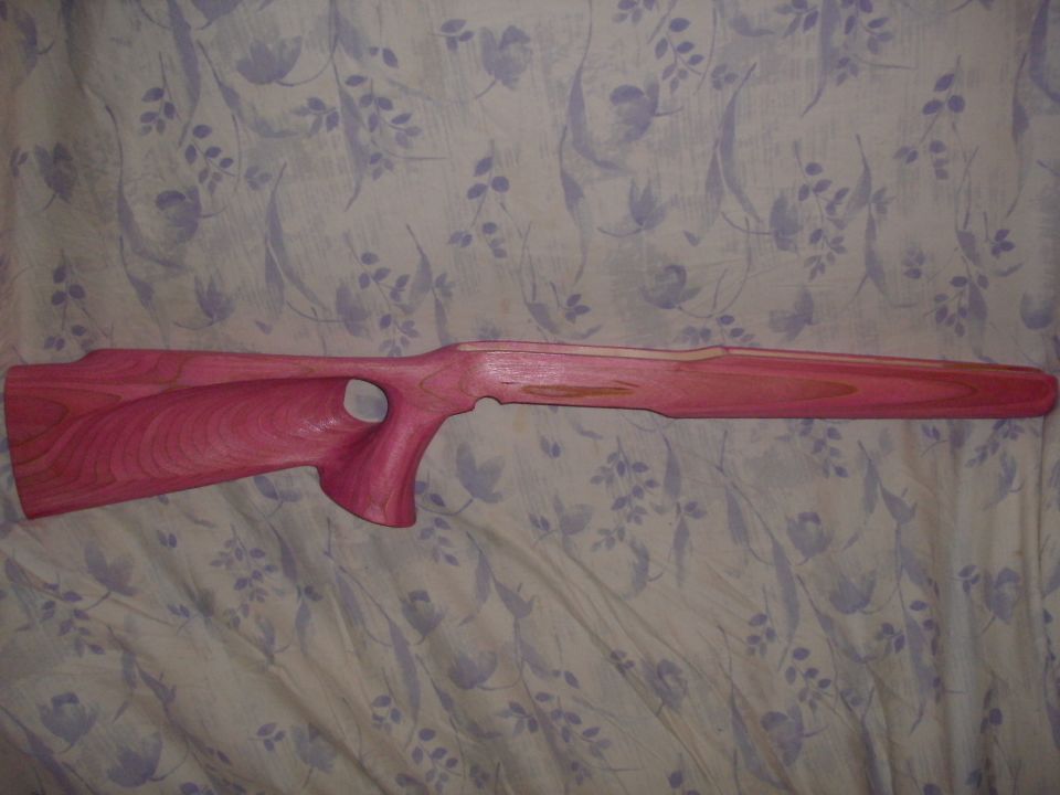 Pink laminated thumbhole rifle stock on floral fabric