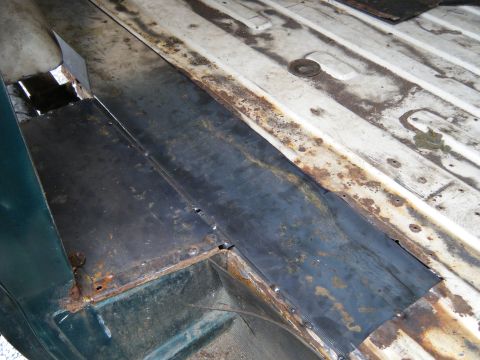 1981 Ford E350 - Repair work on the interior floor panel shows new metal being welded in place.