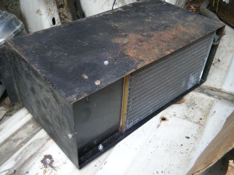 1981 Ford E350 - Heater core assembly, likely for an older vehicle, shows significant rust and wear.