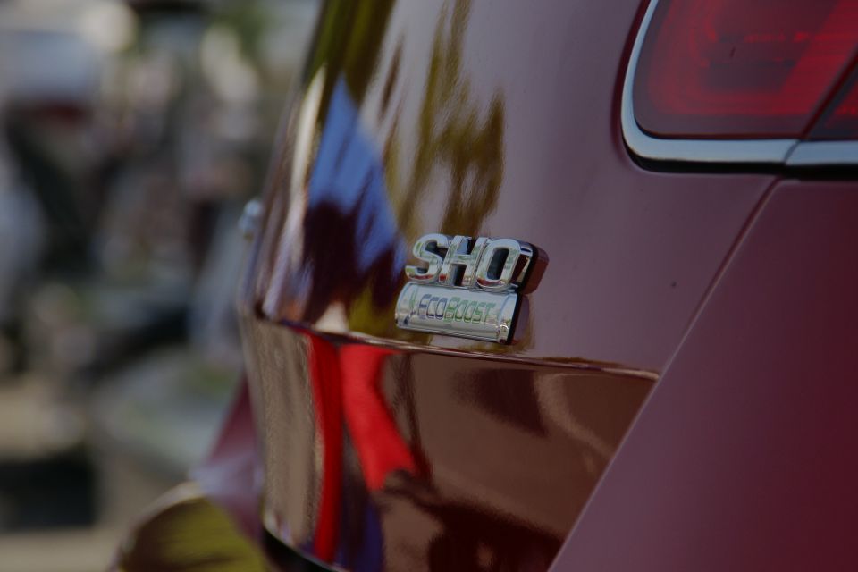 Red car rear quarter panel with SHO EcoBoost badge