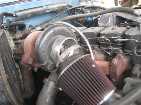 1976 Ford F-250 - Engine bay detail showing a turbocharger and air intake system.