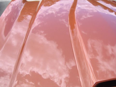 1980 Chevrolet Camaro - Reflections of clouds on a car hood.
