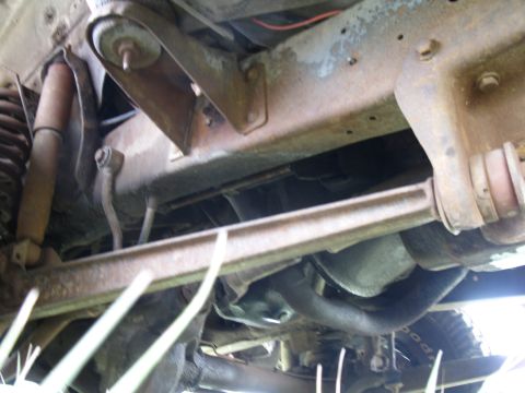 1978 Ford Bronco - Close-up of the undercarriage, showing suspension and frame parts.