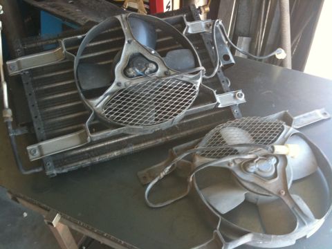 1987 Suzuki Samurai - Radiator and cooling fans removed from a vehicle, likely for repair or replacement.