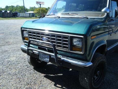 1981 Ford E350 - This 1981 Ford E350 features a distinctive chrome grille and a protective bull bar on its front end.