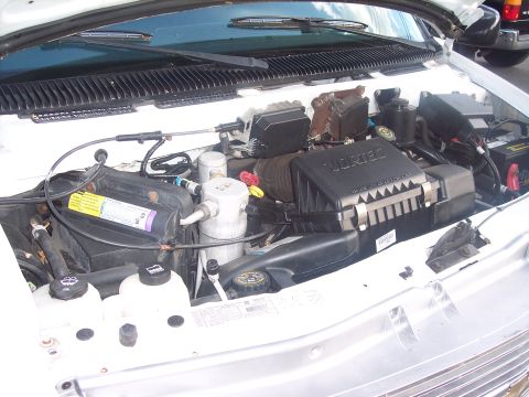 2006 Chevrolet Corvette - The engine bay of a vehicle is shown, with the VORTEC air intake prominently visible.