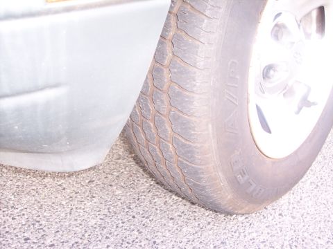 2006 Chevrolet Corvette - A close-up view shows the tread of a vehicle's tire and a portion of its body panel.