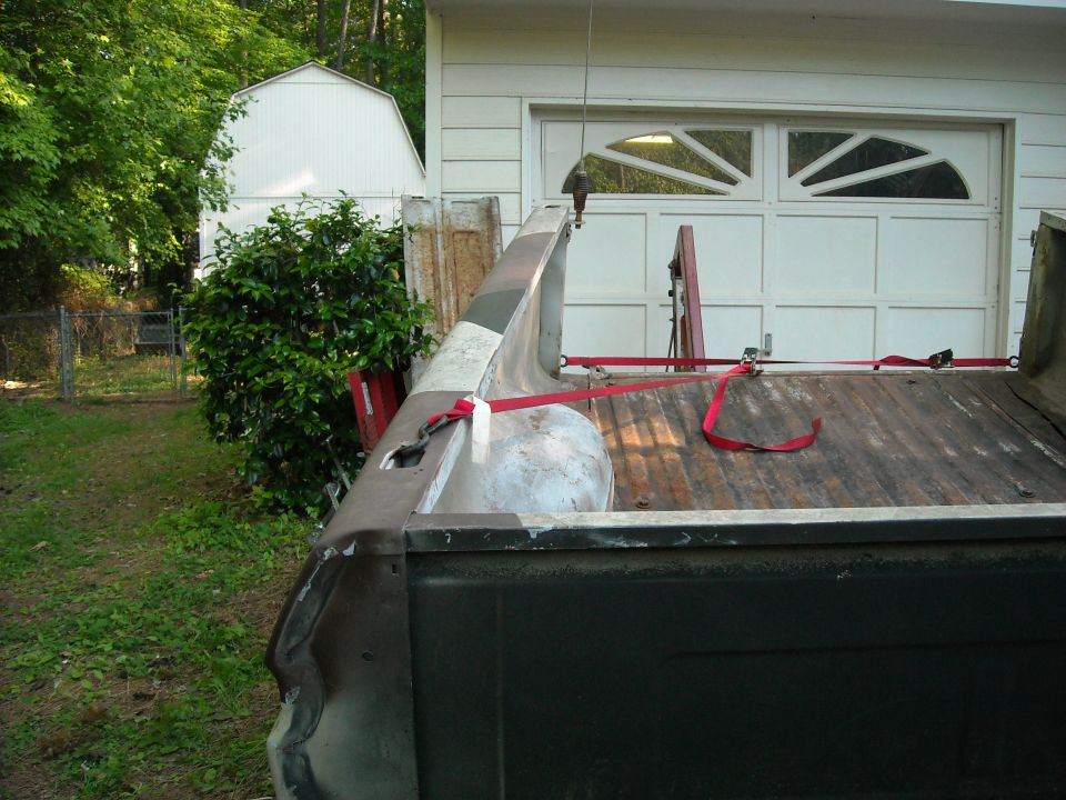 1979 Ford F-150 truck bed with red tie-down straps