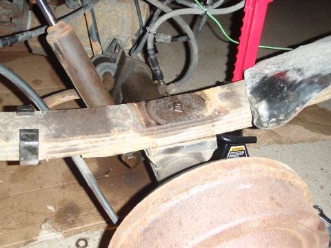 1995 Ford Bronco - Vehicle's rear suspension components, including leaf springs and shock absorber, are visible.