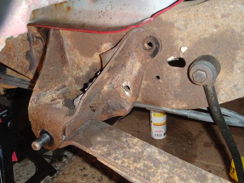 1995 Ford Bronco - Close-up view of corroded vehicle suspension components, showing significant rust and wear.