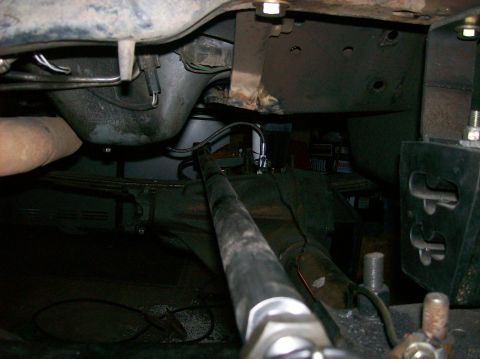 1989 Ford Bronco - Underside view of a vehicle's chassis, focusing on mechanical parts and suspension system.