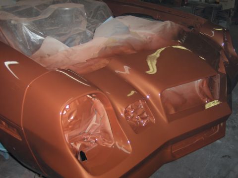 1980 Chevrolet Camaro - The front end of a 1980 Chevrolet Camaro is shown in a metallic bronze paint, likely during a restoration or custom paint job.