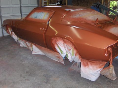 1980 Chevrolet Camaro - Car body is covered in masking and drop cloths for spray painting.