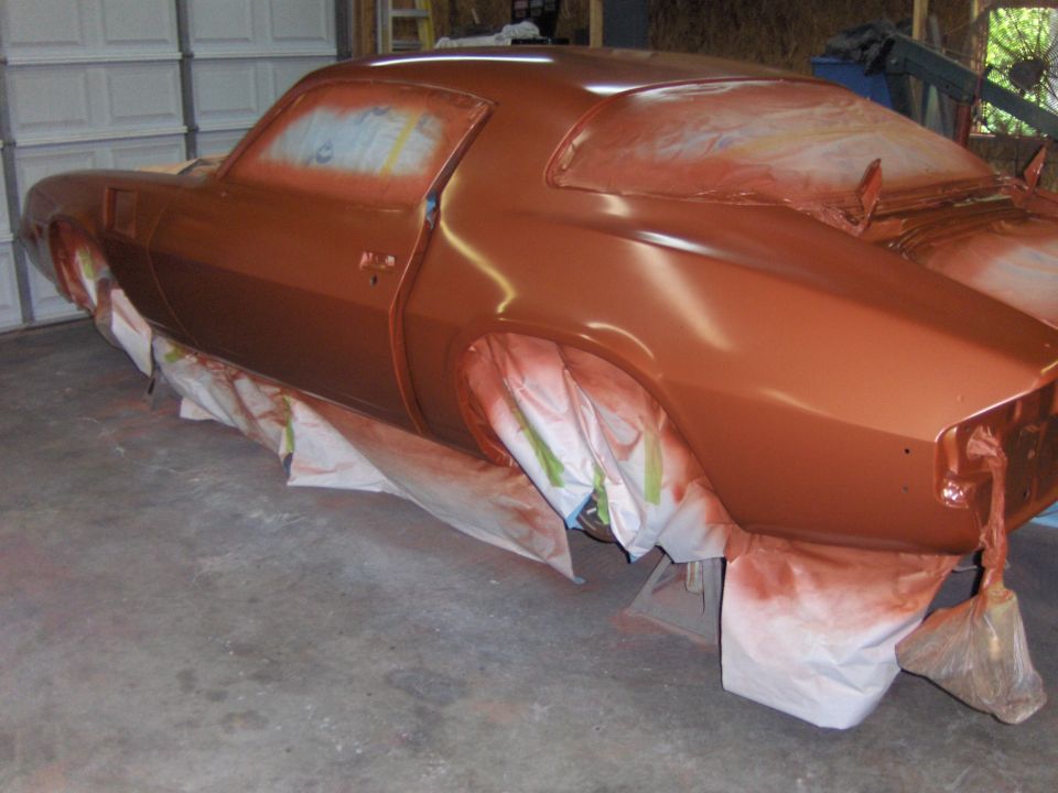 1980 Chevrolet Camaro in primer, being prepped for paint. Wheels are covered