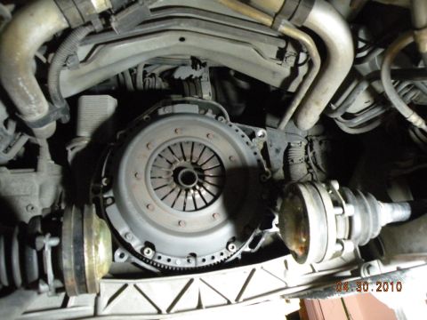 2000 Porsche Carrera - Close-up view of a vehicle's clutch and drive axle components.