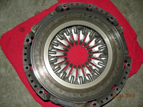 2000 Porsche Carrera - A close-up view of a vehicle's clutch pressure plate, showing its internal components and some stamped markings.