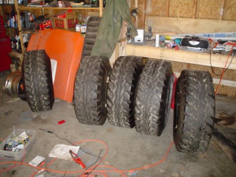 1981 Ford Bronco - Hummer tires, with 9-10" 2x4 peices in them to make them used to being on a rim(kinda)