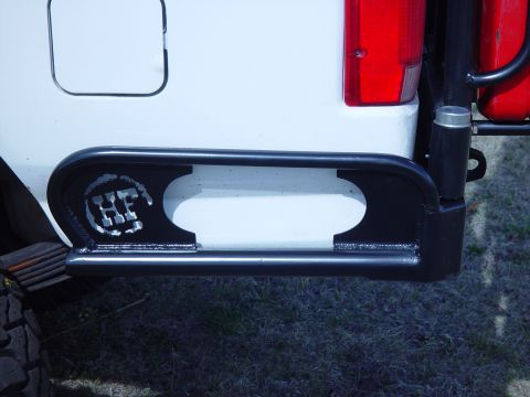 1993 Ford Bronco - Custom rear bumper and sliders on a white vehicle with a red taillight.