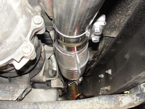 1995 Ford Bronco - Underbody view of a vehicle's exhaust system and transmission components.