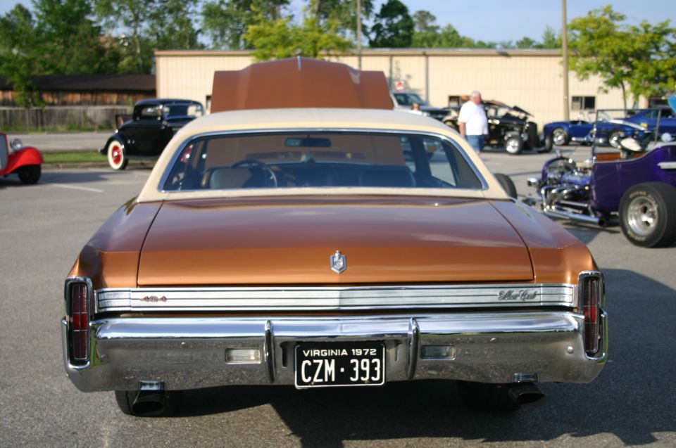 Brown 1972 Chevrolet Monte Carlo rear view with tan vinyl top and chrome bumper