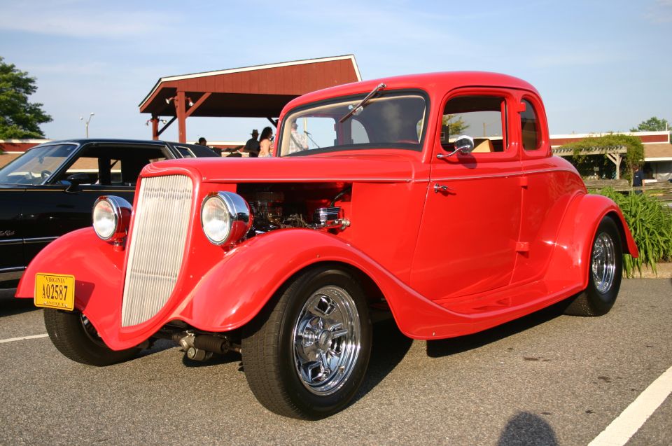 Red hot rod coupe with chrome grille and wheels. Virginia plate A02587