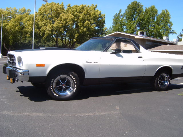 White and black 1973 Ford Ranchero side view with aftermarket wheels