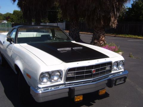 1973 Ford Ranchero - Front view of a 1973 Ford Ranchero with a black hood scoop and grille.
